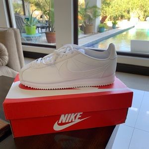 All white nike cortez shoes